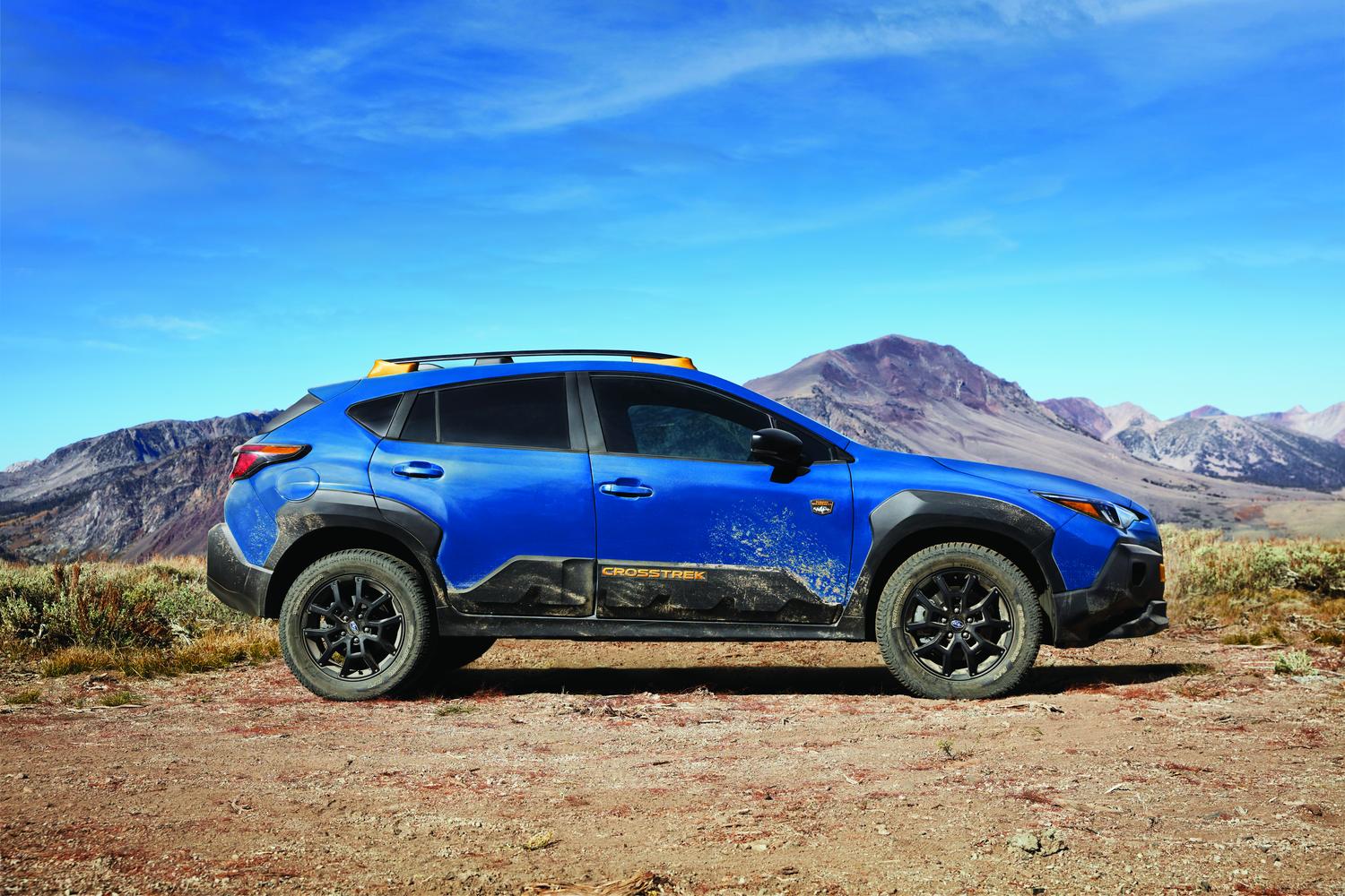 2026 Subaru Crosstrek Wilderness in blue parked on a high desert ridge