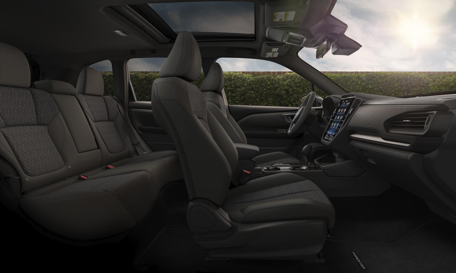 2026 Subaru Forester interior showing dark upholstery and front seating detail